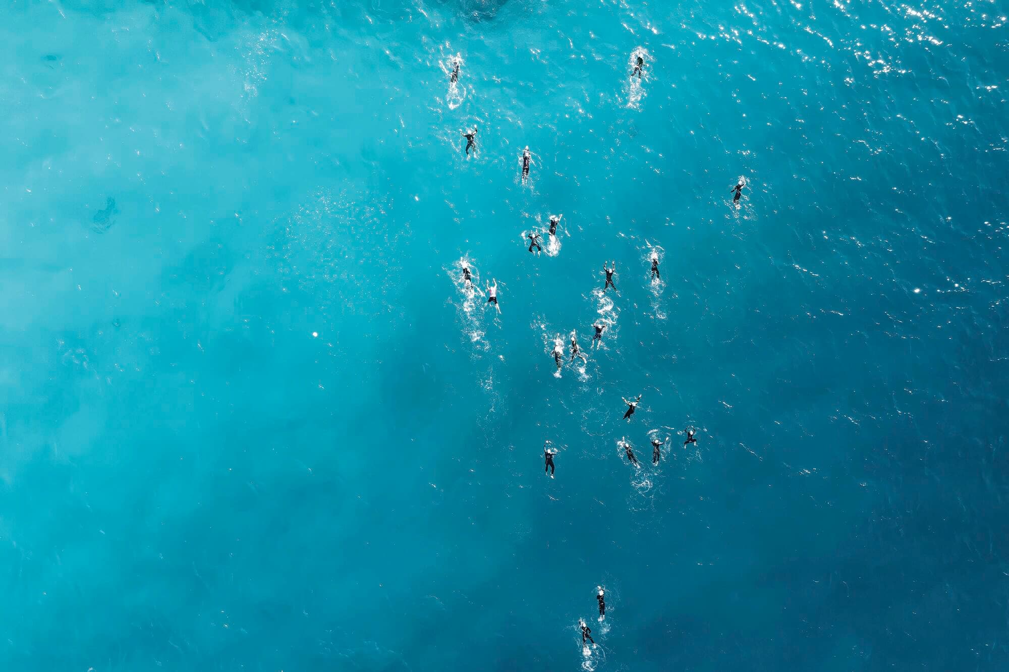 Open-water swimmers competing during a triathlon race