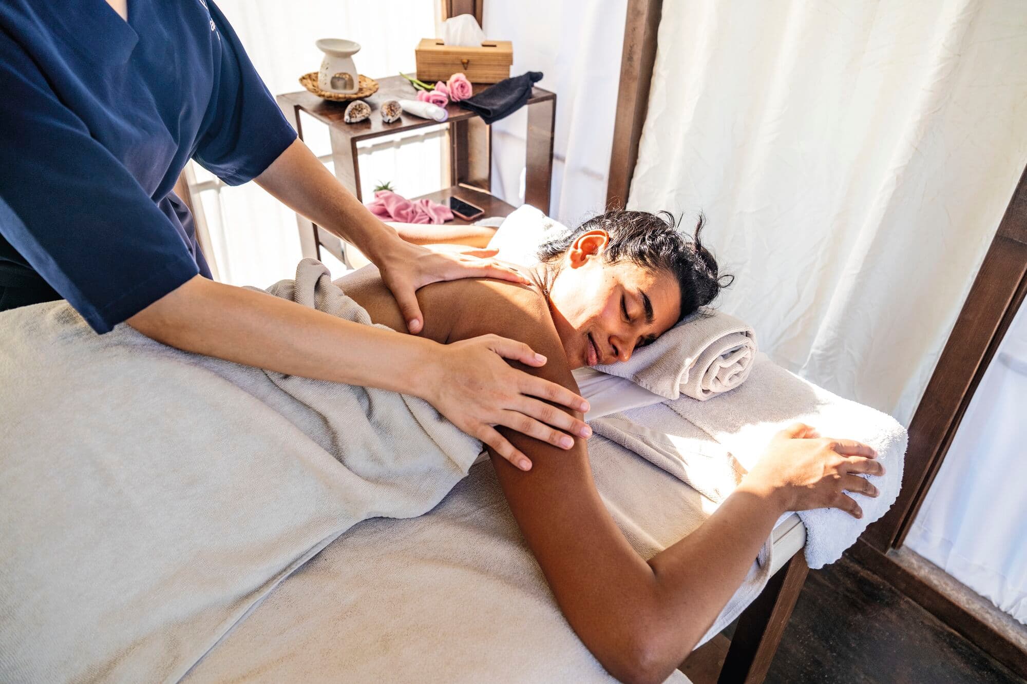 A close-up of a person getting a massage on a massage table.