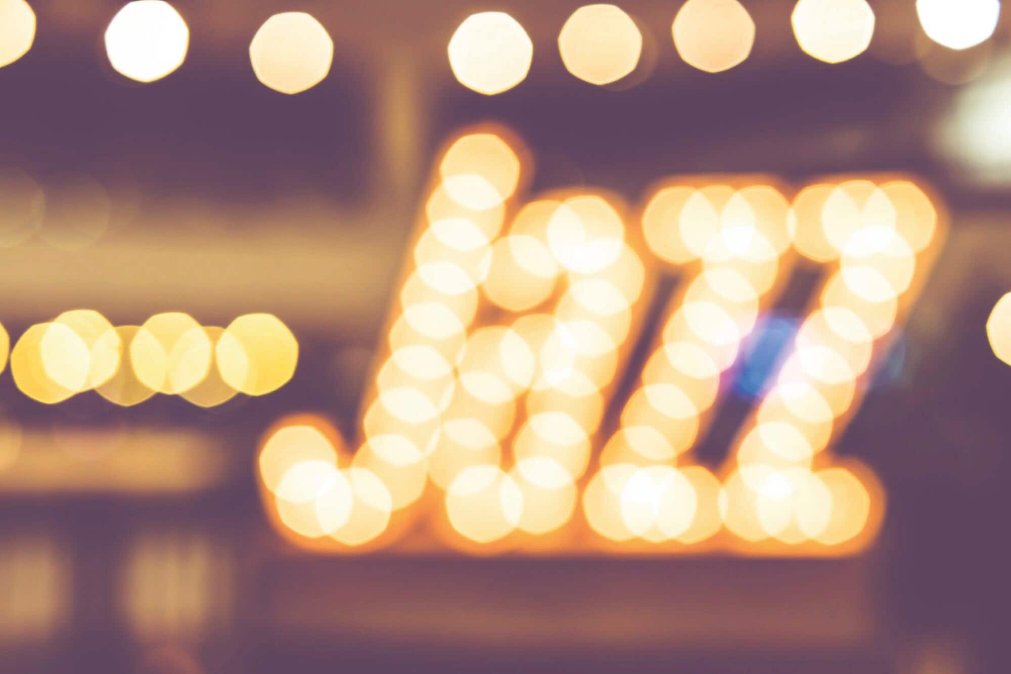 Abstract blur of the word Jazz with faint LED light bulbs in the background