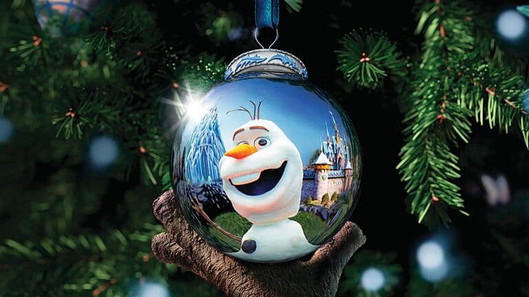 A bauble on a Christmas tree with Olaf's reflection.