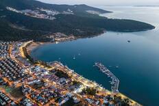 A view of the town and coast at dusk