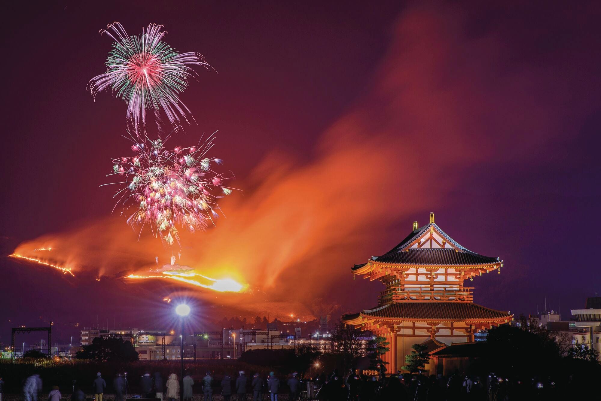 The celebratory Wakakusa Yamayaki fires viewed from the Suzakumon Gate, Nara