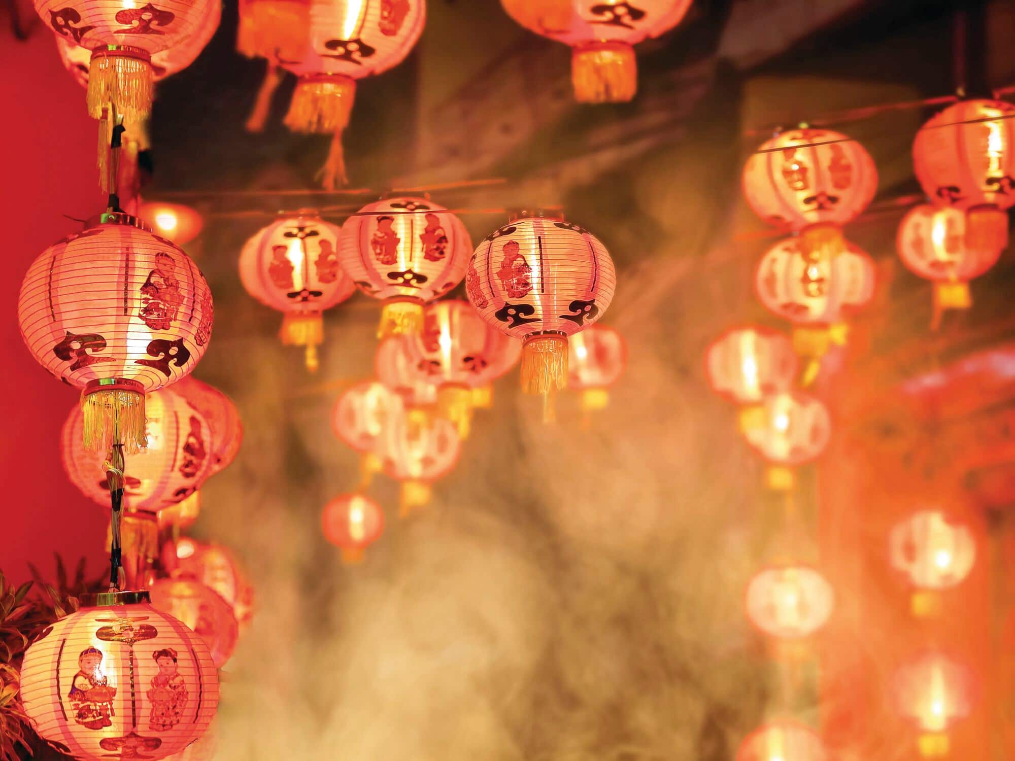Red Chinese lanterns hanging in a festive display.